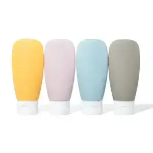 Refillable travel bottles in yellow pink blue and grey for toiletries and personal-care liquids