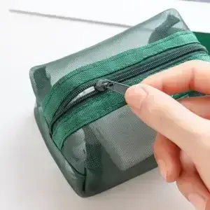 Green mesh travel organizer pouch zipper detail for cables chargers and accessories
