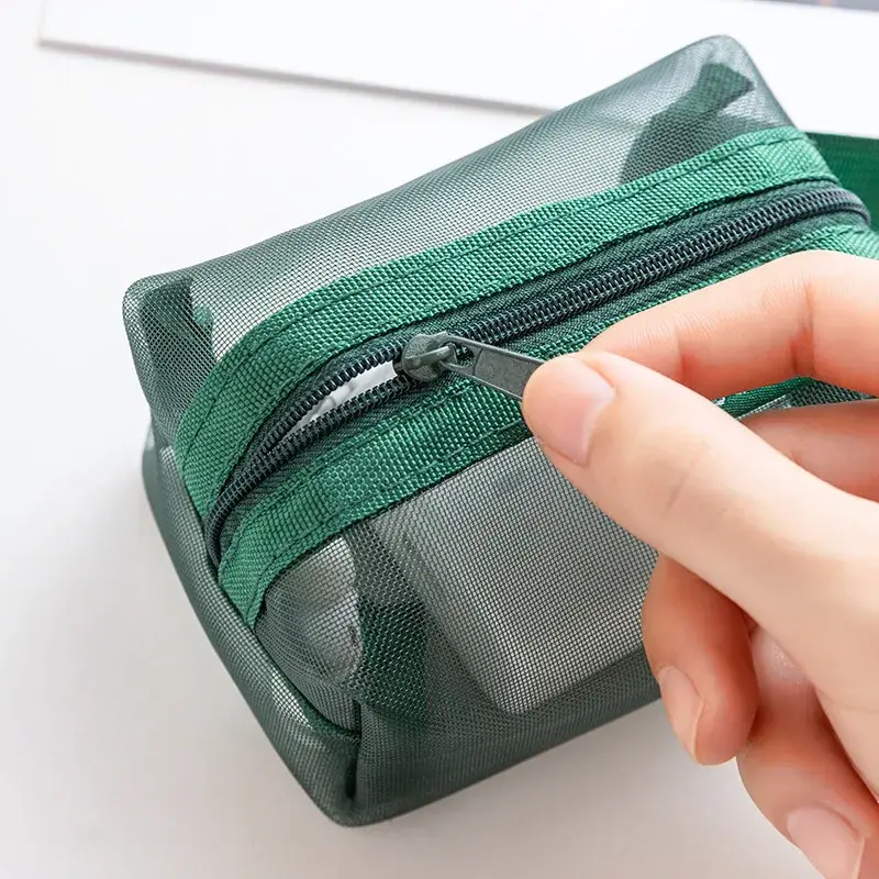 Green mesh travel organizer pouch zipper detail for cables chargers and accessories