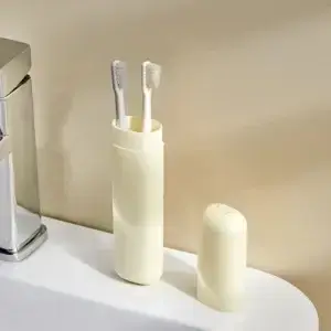 Travel Toothbrush Holder — open beige holder containing toothbrushes