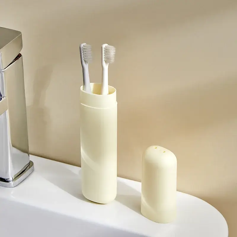 Travel Toothbrush Holder — open beige holder containing toothbrushes