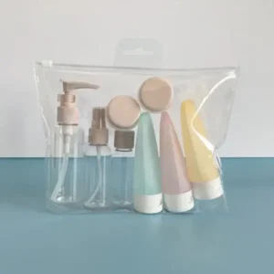 Cosmetic liquid containers for travel with pastel bottles and jars in a clear pouch