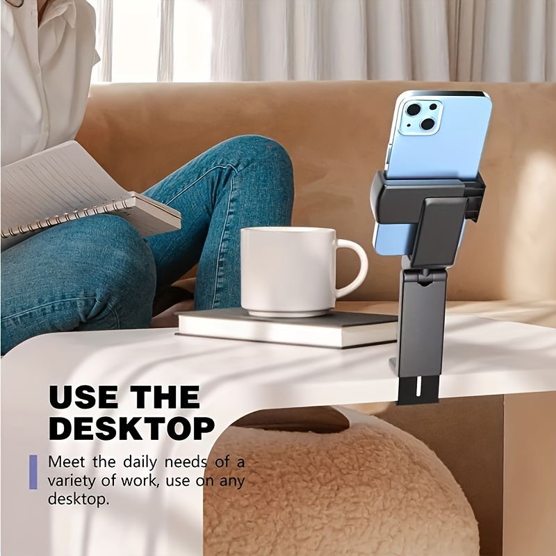 Black phone holder clamped to a desktop with a phone in portrait orientation