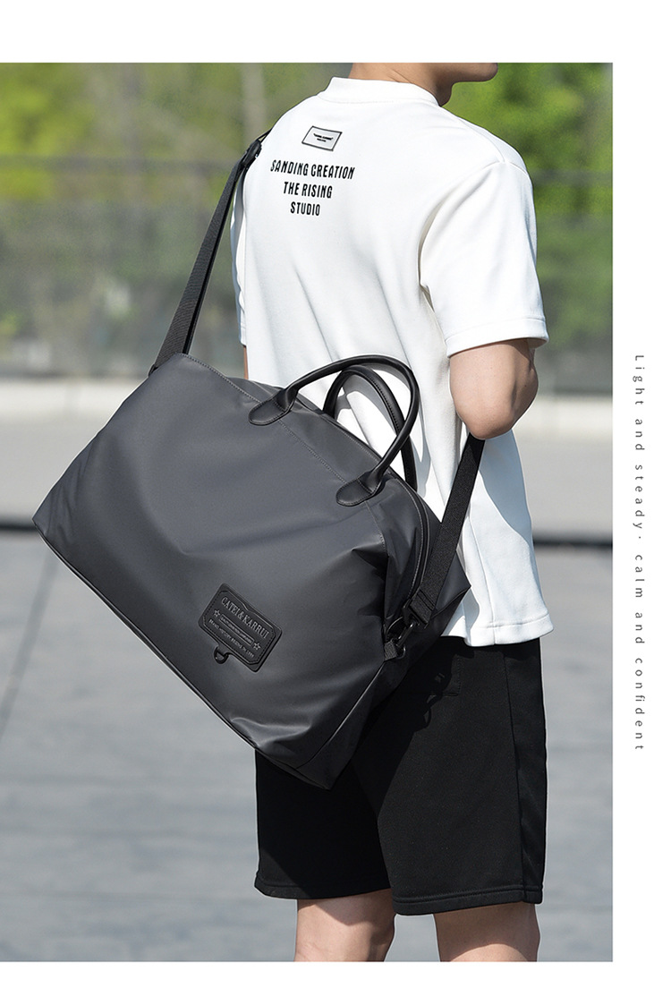 Traveler wearing a gray tote bag over one shoulder